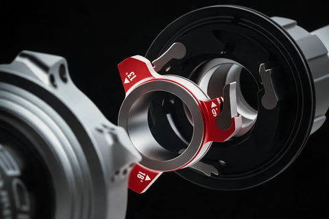 Inside a Sidekick 2.0 hub, the red pawl-pusher ring, marked 9, 13 and 18 degrees, between the freehub body and the hub shell.