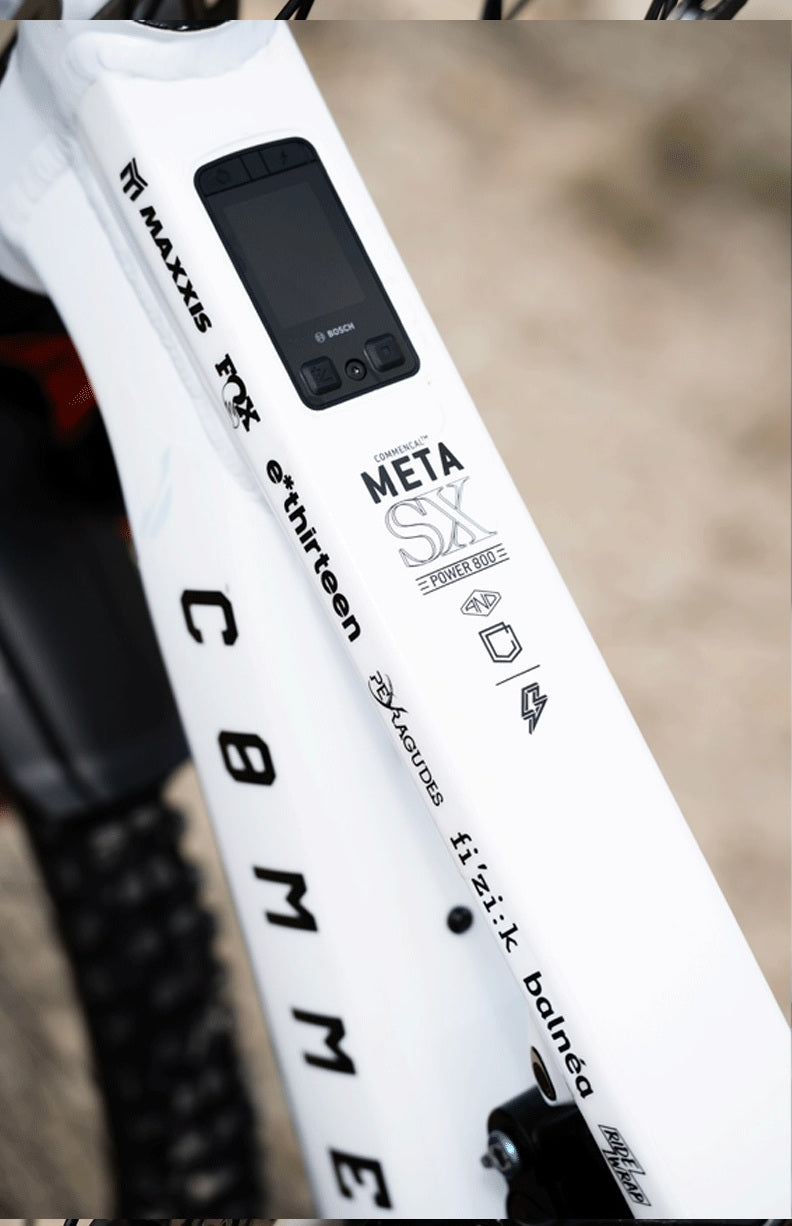 The down tube of Alex Rudeau's Commencal Meta SX Power 800, showing the Bosch display and the e*thirteen decal