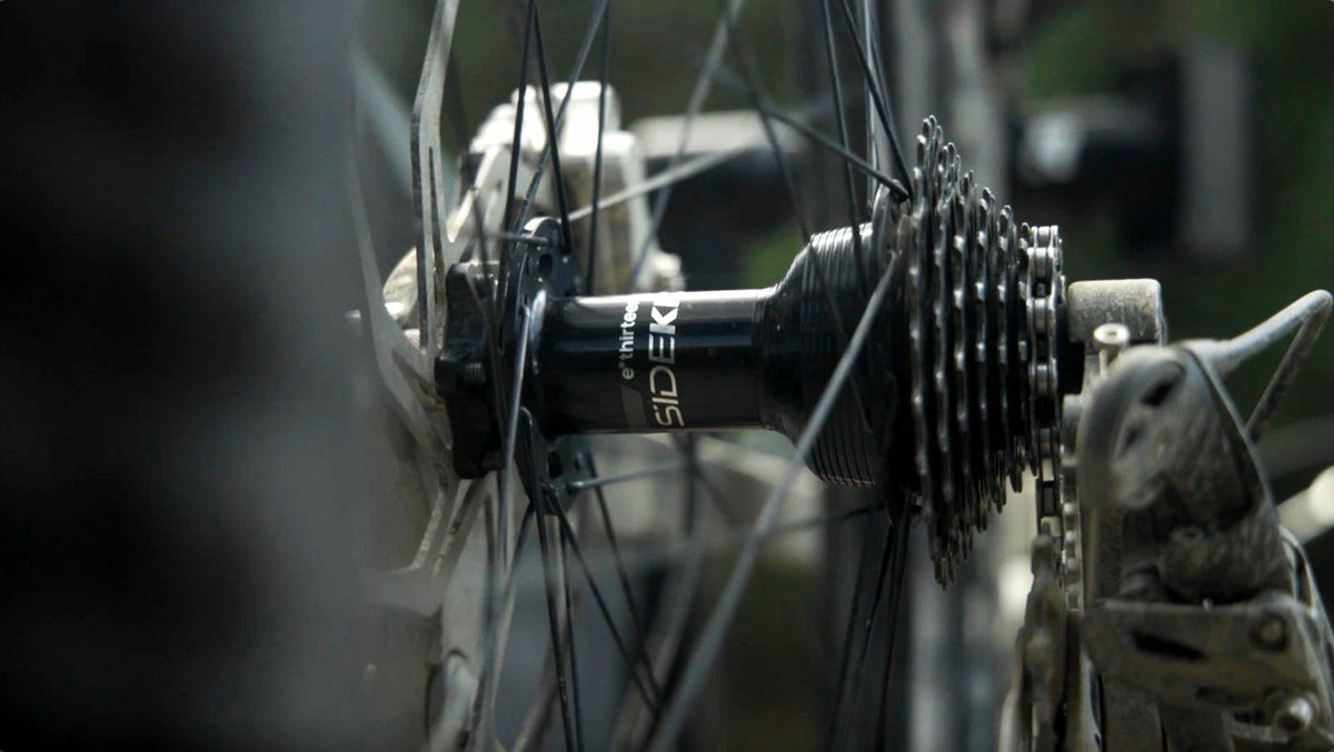 A Sidekick rear hub and cassette on a bike, photographed trailside